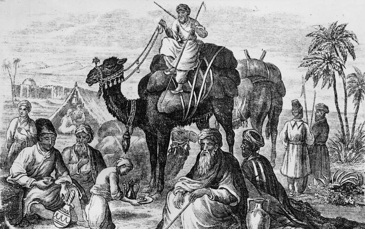 خادم يقدم القهوة لمجموعة من تجار العرب الذين أقاموا مخيما في الصحراء حوالي عام 1850.