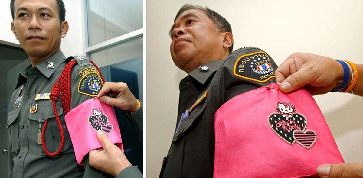 رجال الشرطة الفاسدين في تايلاند يُجبرون على ارتداء شارات (هيلو كيتي) الوردية